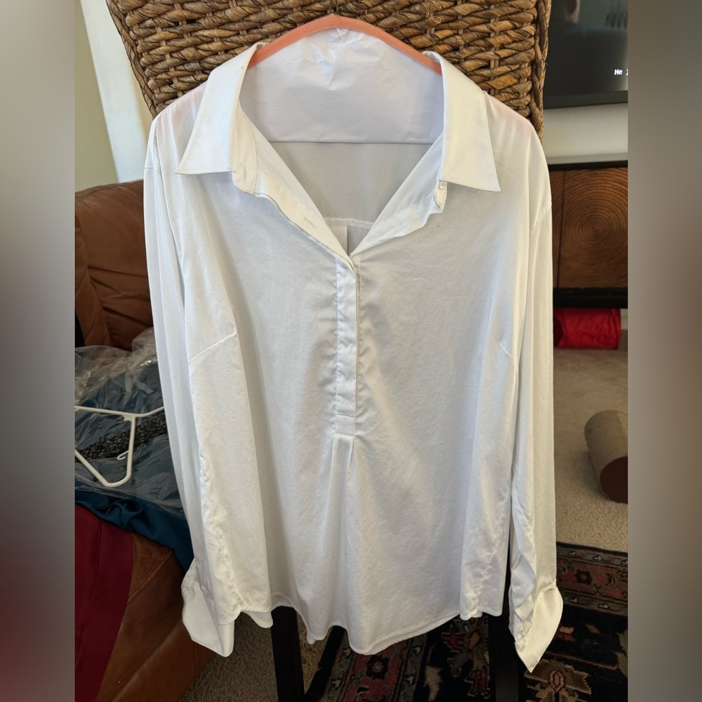 Universal standard classic collared half button shirt.